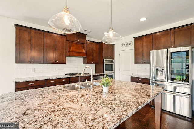 847 Rolling Hl, Kennesaw, GA 30152 - kitchen with appliances with stainless steel finishes, custom range hood, light stone countertops, a sink, and tasteful backsplash
