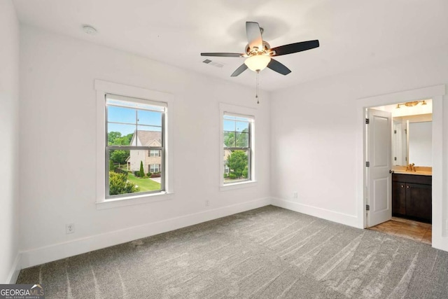 847 Rolling Hl, Kennesaw, GA 30152 - unfurnished bedroom featuring baseboards, carpet floors, ensuite bath, and a ceiling fan