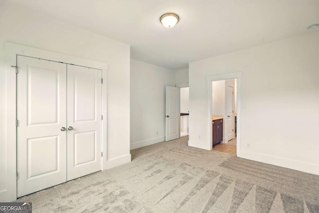 847 Rolling Hl, Kennesaw, GA 30152 - unfurnished bedroom with light colored carpet, baseboards, a closet, and ensuite bathroom