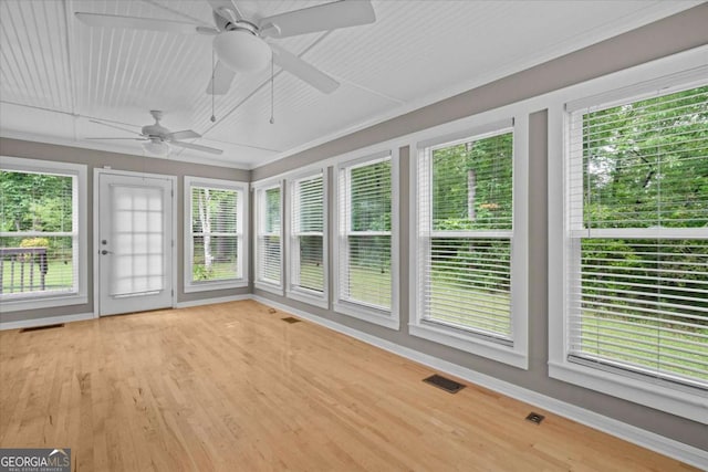 1267 Austin Bridge Rd, Douglasville, GA 30134 - unfurnished sunroom with plenty of natural light, wood finished floors, and crown molding