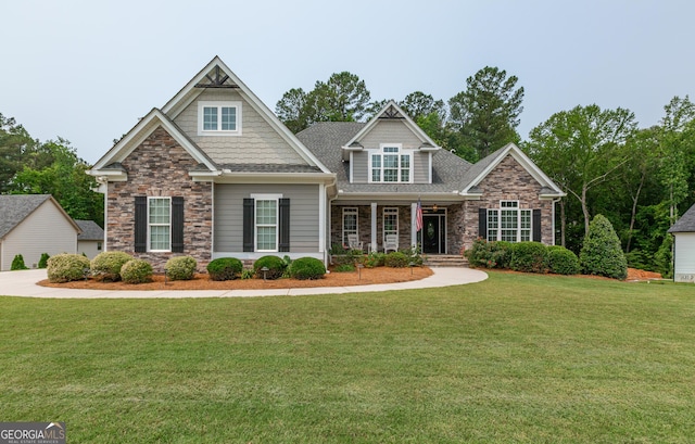 319 Beaconsfield Dr, Sharpsburg, GA 30277 - craftsman inspired home with stone siding, a front yard, a porch, and a shingled roof