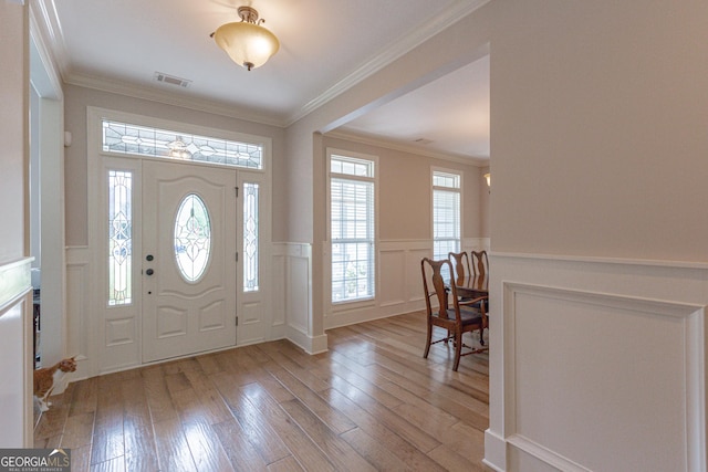 319 Beaconsfield Dr, Sharpsburg, GA 30277 - entryway with a decorative wall, hardwood / wood-style floors, wainscoting, and ornamental molding