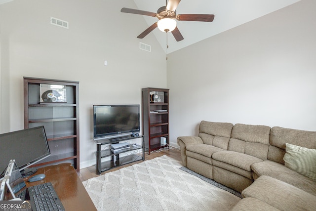 319 Beaconsfield Dr, Sharpsburg, GA 30277 - living room with ceiling fan, high vaulted ceiling, wood finished floors, and baseboards