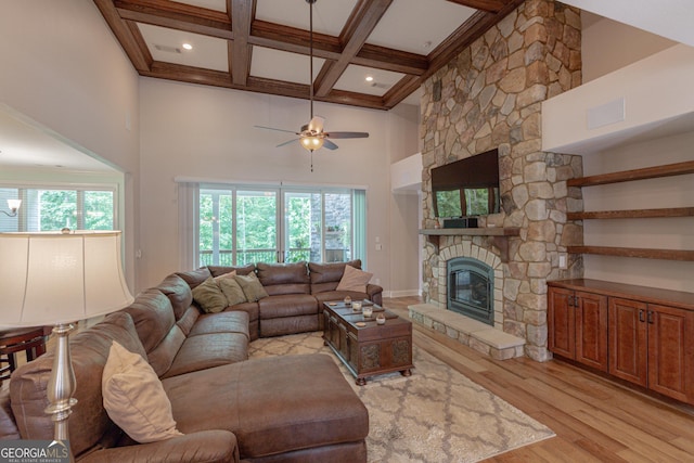 319 Beaconsfield Dr, Sharpsburg, GA 30277 - living area featuring light wood-style flooring, a high ceiling, beam ceiling, ceiling fan, and a fireplace