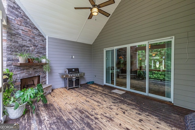 319 Beaconsfield Dr, Sharpsburg, GA 30277 - wooden deck with an outdoor stone fireplace, area for grilling, and a ceiling fan