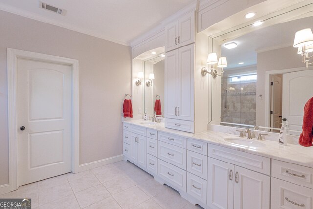 319 Beaconsfield Dr, Sharpsburg, GA 30277 - bathroom with ornamental molding, double vanity, a tile shower, tile patterned flooring, and baseboards