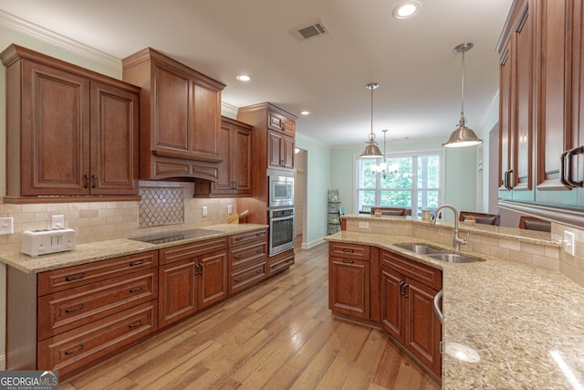 319 Beaconsfield Dr, Sharpsburg, GA 30277 - kitchen with appliances with stainless steel finishes, a sink, ornamental molding, light wood-style floors, and light stone counters