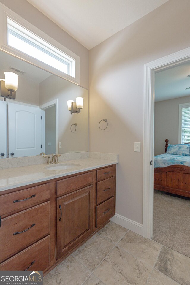 319 Beaconsfield Dr, Sharpsburg, GA 30277 - ensuite bathroom with vanity and baseboards