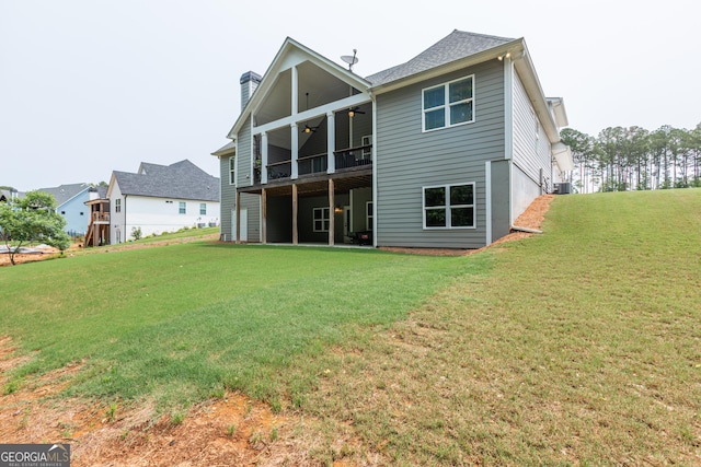 319 Beaconsfield Dr, Sharpsburg, GA 30277 - back of house featuring ceiling fan, a lawn, a chimney, central AC unit, and a balcony