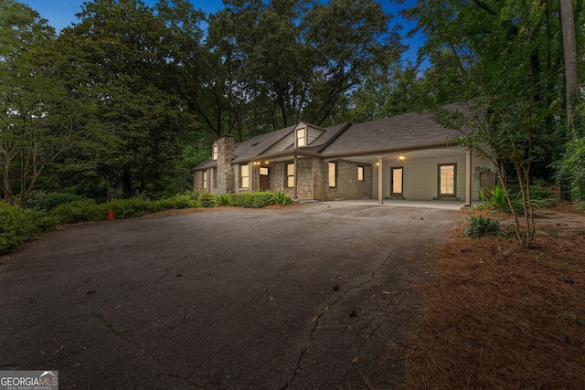 2596 Midway Rd, Decatur, GA 30030 - view of front of property with asphalt driveway, stone siding, and an attached carport