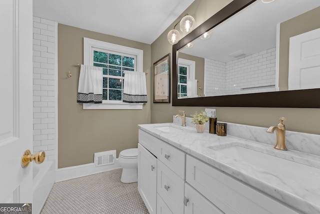 2596 Midway Rd, Decatur, GA 30030 - bathroom featuring double vanity, toilet, tile patterned flooring, baseboards, and shower / washtub combination