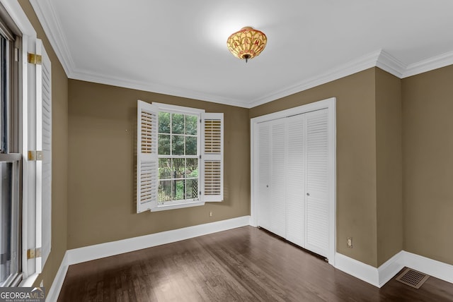 2596 Midway Rd, Decatur, GA 30030 - unfurnished bedroom featuring ornamental molding, wood finished floors, baseboards, and a closet