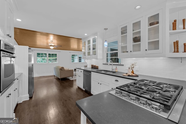 2596 Midway Rd, Decatur, GA 30030 - kitchen featuring a sink, stainless steel appliances, dark countertops, white cabinets, and dark wood-style floors