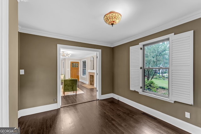 2596 Midway Rd, Decatur, GA 30030 - spare room with baseboards, dark wood-style flooring, crown molding, and a fireplace