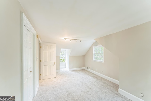2596 Midway Rd, Decatur, GA 30030 - bonus room with baseboards, light carpet, and vaulted ceiling