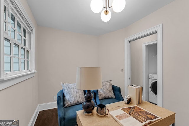 2596 Midway Rd, Decatur, GA 30030 - living area with washer / clothes dryer, wood finished floors, baseboards, and a chandelier