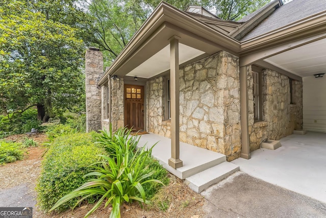 2596 Midway Rd, Decatur, GA 30030 - property entrance with stone siding, a chimney, and a shingled roof