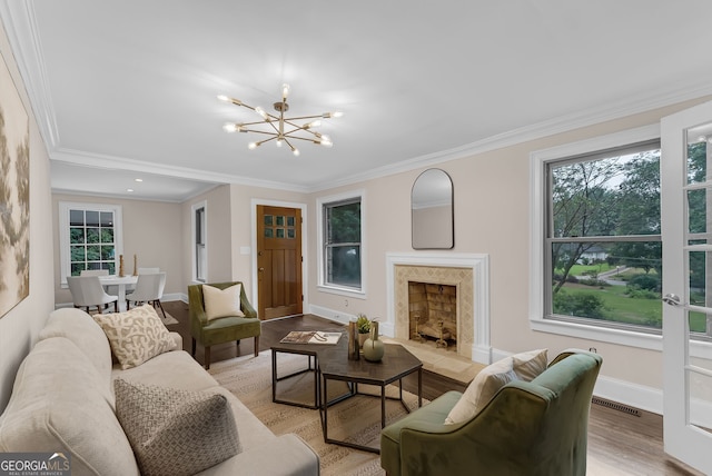 2596 Midway Rd, Decatur, GA 30030 - living room featuring a chandelier, ornamental molding, light wood finished floors, baseboards, and a premium fireplace