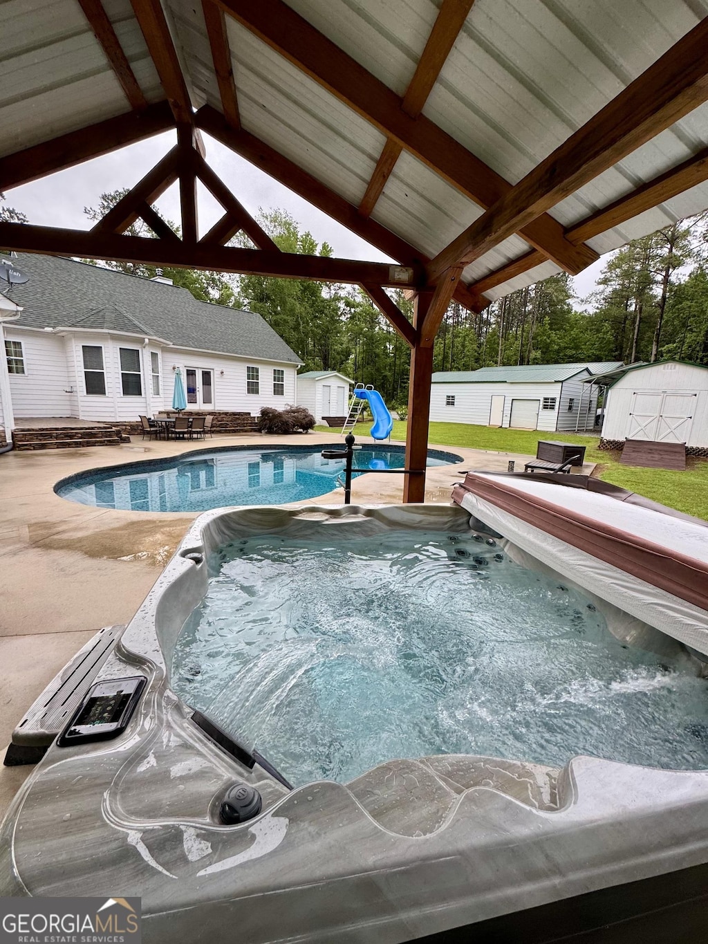 4288 Ga Highway 16 W, Monticello, GA 31064 - view of pool with a covered hot tub and a patio
