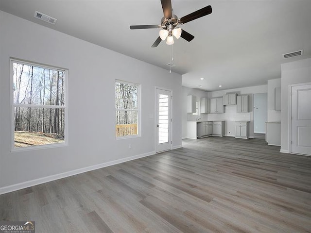 250 Shawnee Trl, Dallas, GA 30157 - unfurnished living room featuring ceiling fan, wood finished floors, and recessed lighting
