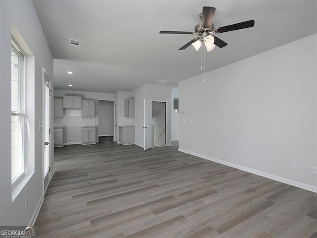 250 Shawnee Trl, Dallas, GA 30157 - unfurnished living room featuring wood finished floors, recessed lighting, healthy amount of natural light, and a ceiling fan
