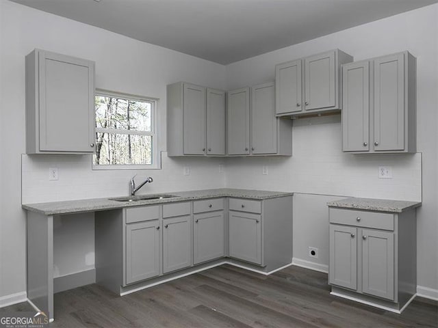 250 Shawnee Trl, Dallas, GA 30157 - kitchen featuring gray cabinetry, tasteful backsplash, dark wood-style floors, and light stone countertops