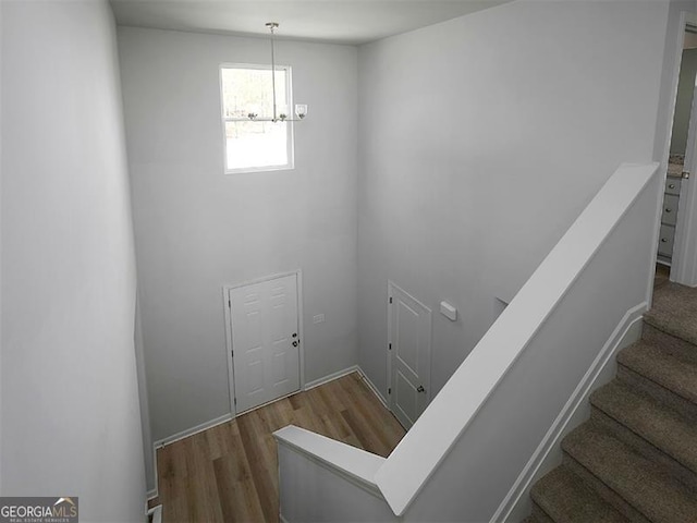250 Shawnee Trl, Dallas, GA 30157 - stairs with a chandelier and wood finished floors