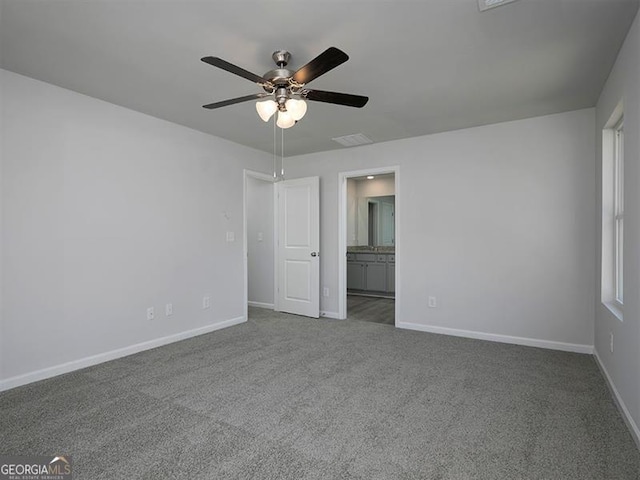 250 Shawnee Trl, Dallas, GA 30157 - unfurnished bedroom with carpet flooring, connected bathroom, and a ceiling fan