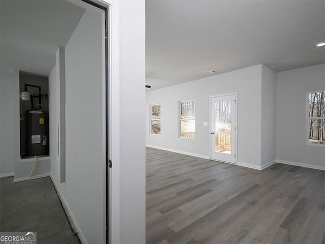 250 Shawnee Trl, Dallas, GA 30157 - corridor featuring water heater and dark wood finished floors