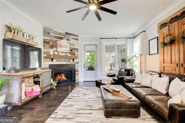 164 Inwood Walk, Woodstock, GA 30188 - living room featuring ornamental molding, ceiling fan, a stone fireplace, and wood finished floors