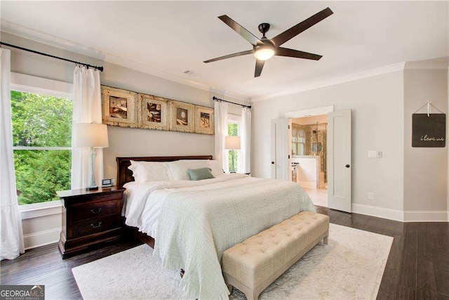 164 Inwood Walk, Woodstock, GA 30188 - bedroom featuring crown molding, dark wood-style floors, baseboards, a ceiling fan, and ensuite bath