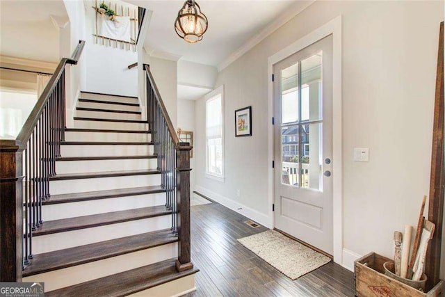 164 Inwood Walk, Woodstock, GA 30188 - foyer featuring stairs, dark wood-style flooring, ornamental molding, baseboards, and a chandelier