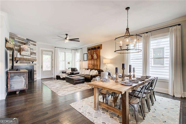 164 Inwood Walk, Woodstock, GA 30188 - dining area featuring a chandelier, wood finished floors, a ceiling fan, ornamental molding, and baseboards