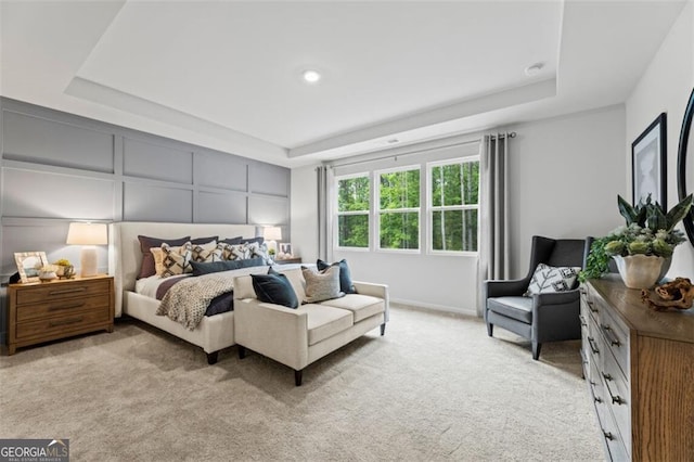 820 Dobby Way Lot 99, Mcdonough, GA 30252 - bedroom featuring a raised ceiling, light colored carpet, and a decorative wall