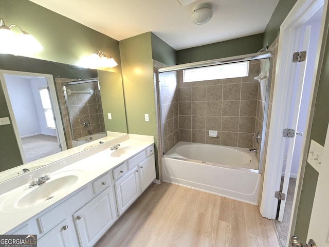 3613 Tinsley Way, Atlanta, GA 30331 - full bath featuring wood finished floors, double vanity, and shower / washtub combination