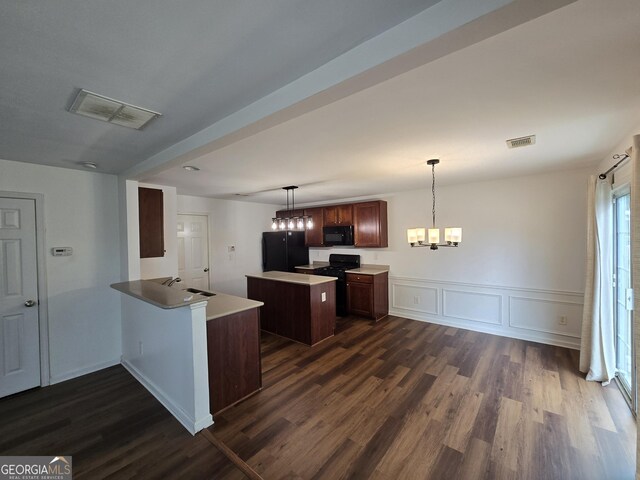 3613 Tinsley Way, Atlanta, GA 30331 - kitchen with black appliances, a kitchen island, dark wood finished floors, a chandelier, and a peninsula