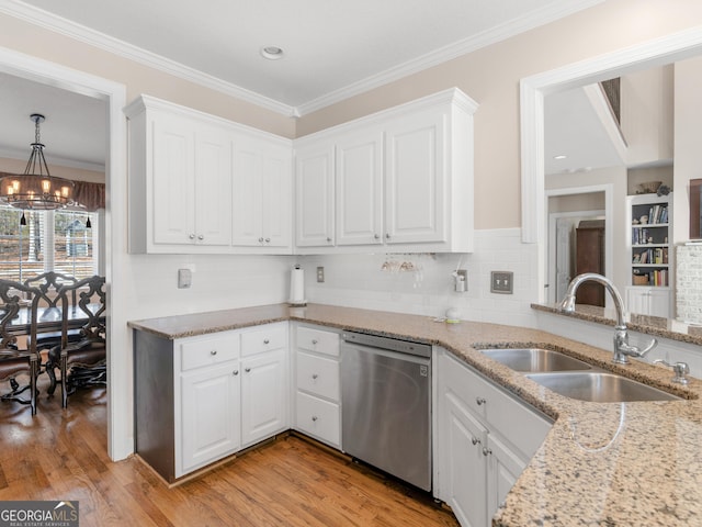 355 Parker Rd, Covington, GA 30014 - kitchen featuring dishwasher, a chandelier, white cabinets, light stone counters, and ornamental molding