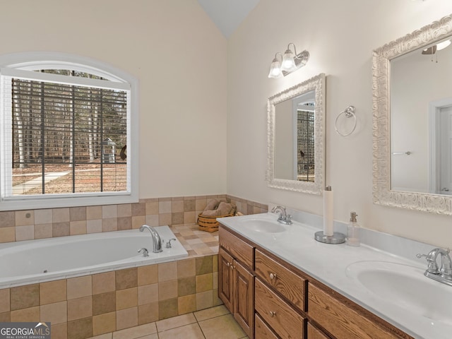 355 Parker Rd, Covington, GA 30014 - bathroom with double vanity, a garden tub, tile patterned floors, and lofted ceiling