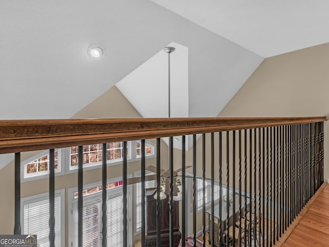 355 Parker Rd, Covington, GA 30014 - stairs featuring vaulted ceiling and wood finished floors