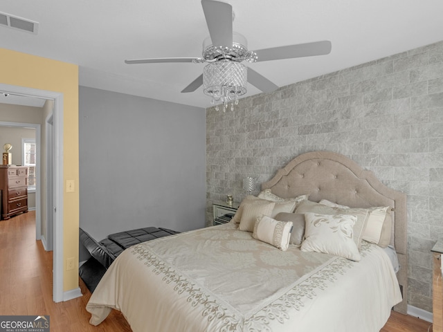 355 Parker Rd, Covington, GA 30014 - bedroom with wood finished floors and ceiling fan