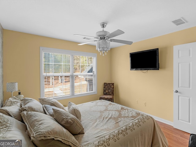 355 Parker Rd, Covington, GA 30014 - bedroom featuring light wood finished floors and a ceiling fan
