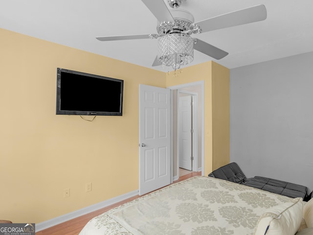 355 Parker Rd, Covington, GA 30014 - bedroom with light wood-style flooring and a ceiling fan