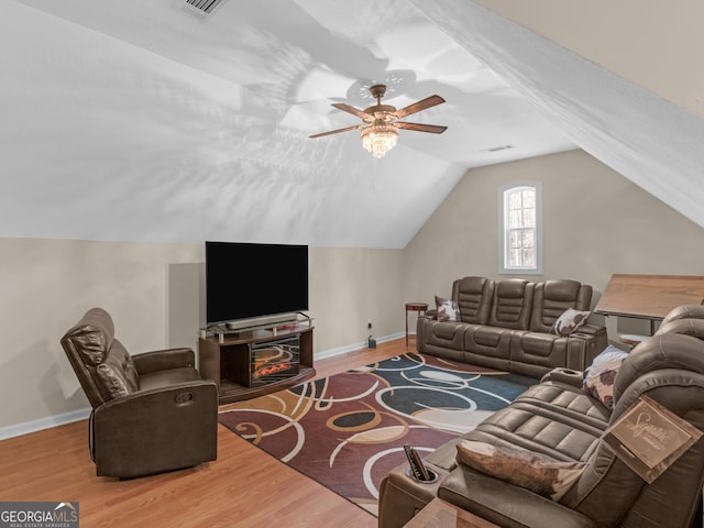 355 Parker Rd, Covington, GA 30014 - living area with wood finished floors, ceiling fan, and lofted ceiling