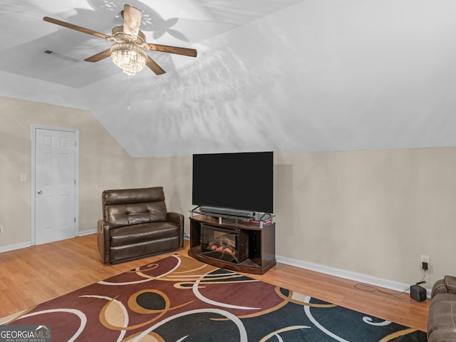 355 Parker Rd, Covington, GA 30014 - living area with vaulted ceiling, wood finished floors, and ceiling fan