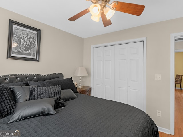 355 Parker Rd, Covington, GA 30014 - bedroom featuring wood finished floors, a closet, and a ceiling fan