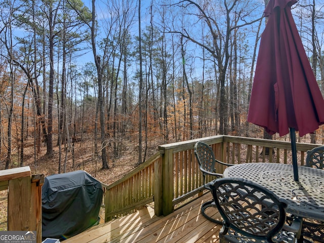 355 Parker Rd, Covington, GA 30014 - wooden terrace with a grill and outdoor dining area