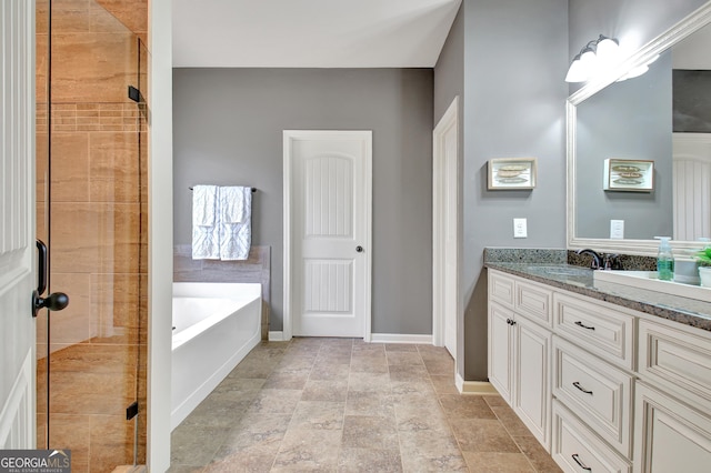 149 Horizon Hl, Newnan, GA 30265 - full bathroom with vanity, a bath, a shower stall, stone finish flooring, and baseboards
