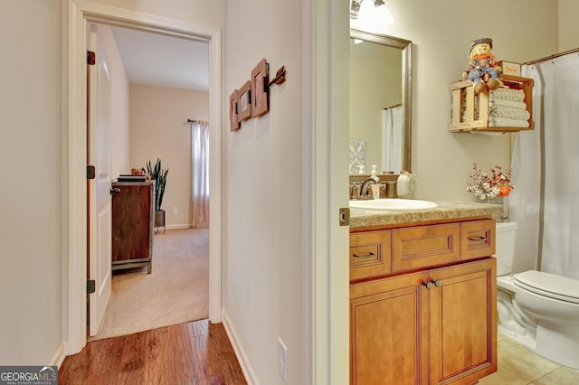 149 Horizon Hl, Newnan, GA 30265 - bathroom featuring toilet, vanity, curtained shower, and wood finished floors