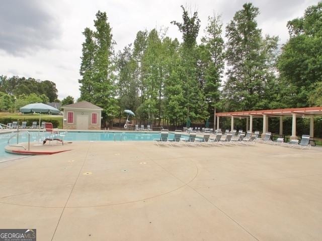 149 Horizon Hl, Newnan, GA 30265 - community pool featuring view of scattered trees and a patio area