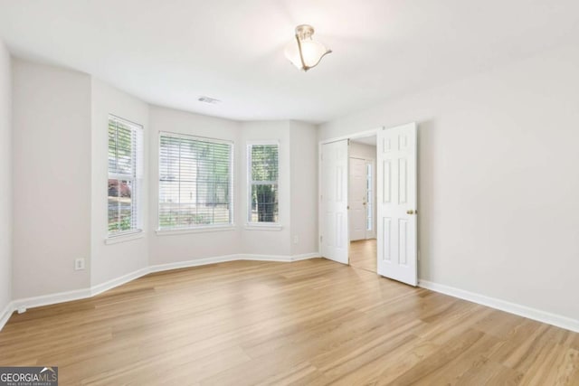 6230 Lillie Ln, Cumming, GA 30040 - unfurnished room with light wood-type flooring and baseboards